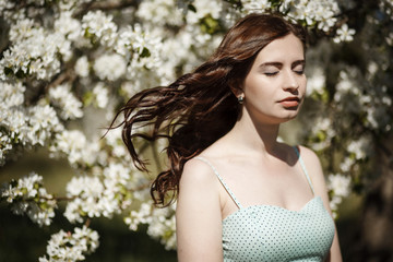 beautiful brunette spring apple flowers walk in the park