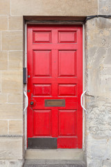 old and rustic red European door