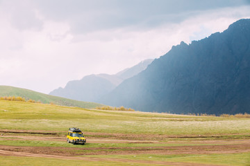 SUV Car On Off Road In Spring Mountains Landscape In Georgia. Dr