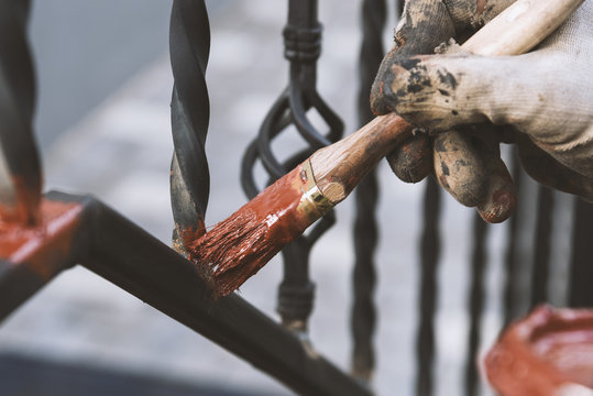 Painting Forged Railings On The Stairs At The Entrance Of The House. Protection Against Rust.