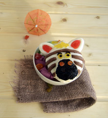 The zebra is made of ice cream. A creative dessert for children and good mood.