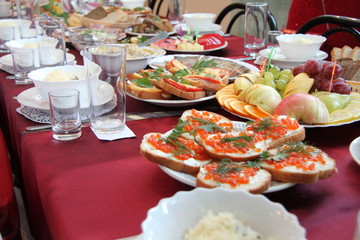 Festive table with food and drinks.