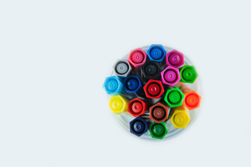 Top view of many different colored pens  isolated on white background