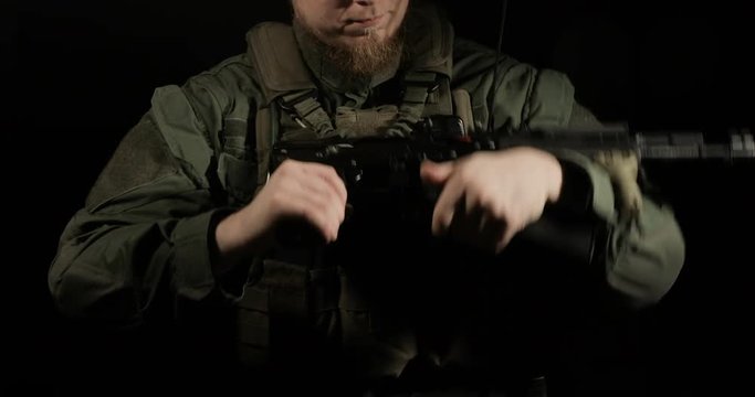 Soldier reloading machine gun