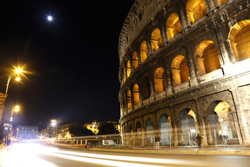 Fototapeta na wymiar Night view of speed road in colosseum, Italy 