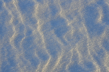 Abstract snowy background in the evening sunlight