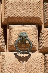 Architectural detail : lion with ring made of metal, Alhambra, Granada, Spain