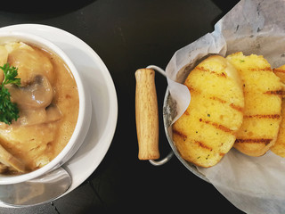 Slices garlic bread and Mashed potatoes in top view.