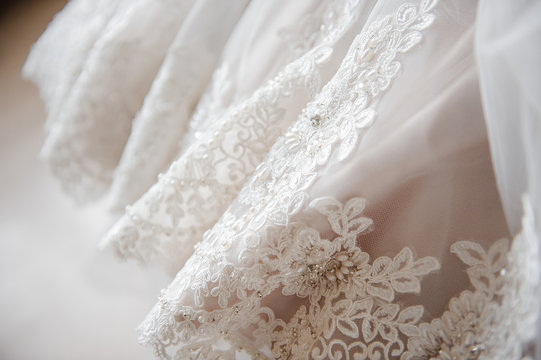 Wedding Dress. A close picture. Embroidery on the dress.