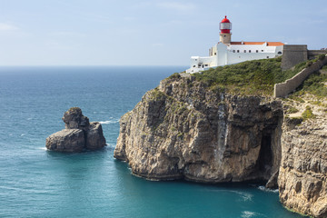 Fototapeta na wymiar lighthouse and rock in the sea