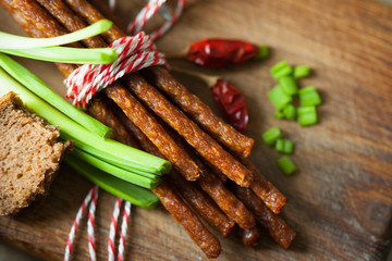 Fresh kabanos sausages, bread and onion 