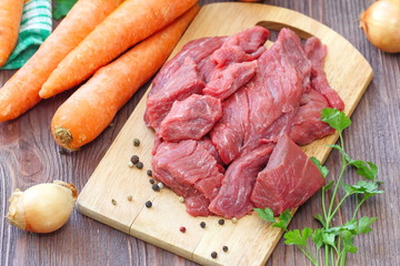 Raw meat with spices and vegetables ready for cook