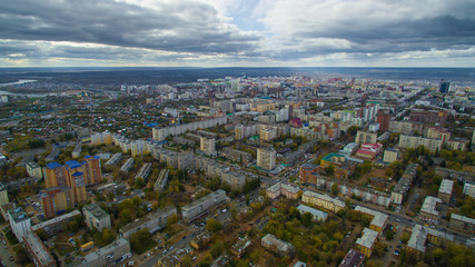 Typical city of Russia at sunset in center. Aerial view