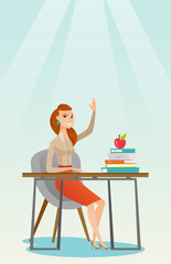 Student raising hand in class for an answer.