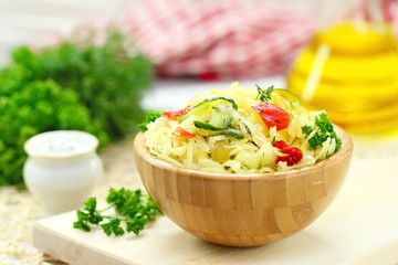 Salad with pickled cabbage, cucumbers, paprika and olive oil