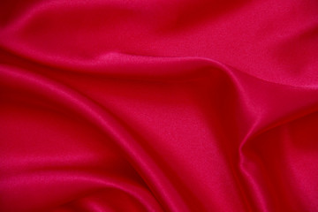 Red cloth waves background texture.