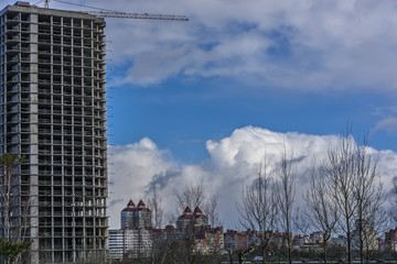 beautiful clouds over the house in the city 