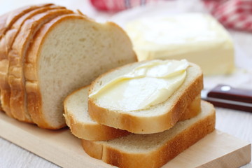 Bread with butter for breakfast - obrazy, fototapety, plakaty
