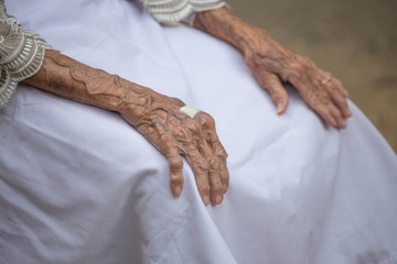 Hands of the old woman.