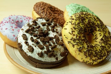 Group of glazed delicious donuts, closeup