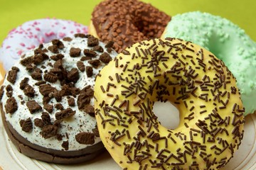 Group of glazed delicious donuts, closeup