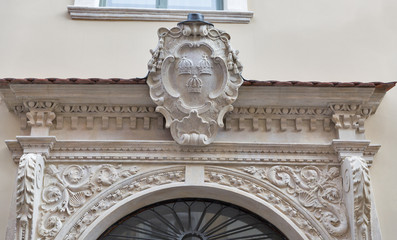 Ancient Coat of Arms above house entrance in Krakow, Poland.