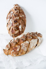 Fresh home made bread with nuts and dry fruits on marble background