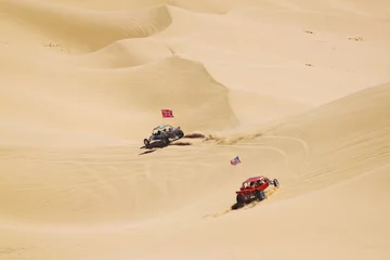 Zelfklevend Fotobehang ATV riders in the vast desert © Annap