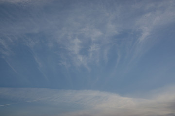 Naklejka na ściany i meble Blue sky with white abstract clouds