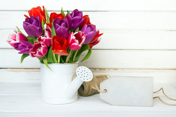 Tulip bouquet on  wooden background, copy space
