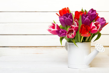 Tulip bouquet on  wooden background, copy space