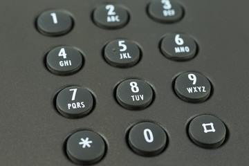 keypad with letter mapping of a black telephone