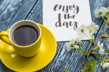 Still life with cup of tea and cake on the wooden background