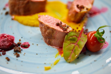 Meat medallions and basil