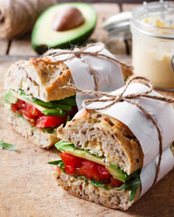Vegan sandwich with avocado and tomatoes