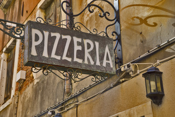 The name of the restaurant is Pizzeria. - obrazy, fototapety, plakaty