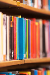 Colorful books on the shelfs with shallow depth of field at the rotunda in Stockholm Stadsbibliotek or Public Library