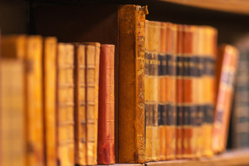 Vintage books on the shelfs with shallow depth of field at the rotunda in Stockholm Stadsbibliotek or Public Library