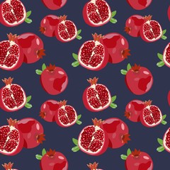 Seamless pattern with ripe pomegranate on a blue background. Vector illustration.