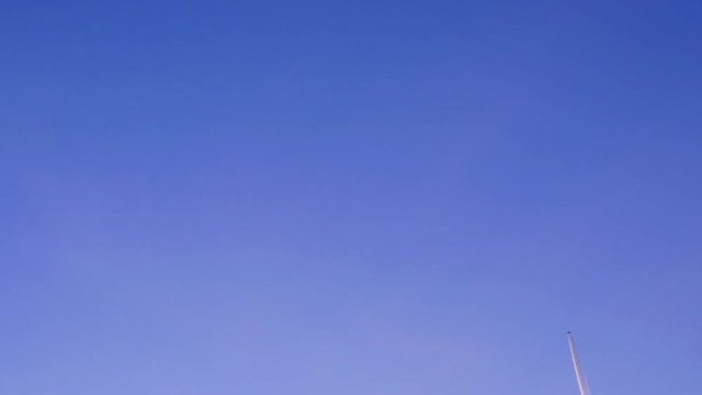 Jet airliner contrail on a blue sky.