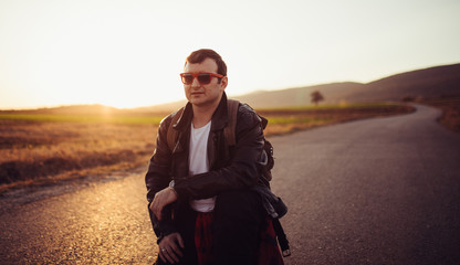 Handsome young man outdoors alone