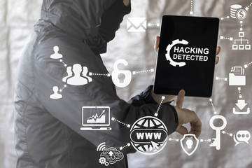 Hacking detected service business insurance concept. Protection from threat hackers. Cyber data social network internet security concept. Web safety. Hacker offers tablet computer with gear hack icon.