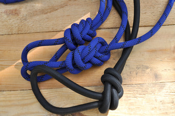 Rope knots on a wooden background top view