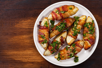 Bacon Wrapped Potatoes with Parsley Garlic Pesto Sauce. Selective focus.
