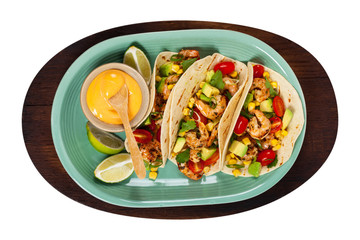 Shrimp Tacos with Corn and Avocado Salsa Isolated on White background. Selective focus.