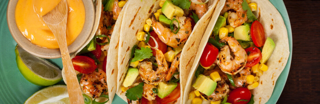 Shrimp Tacos with Corn and Avocado Salsa Panoramic image. Selective.