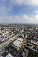 Fototapeta premium Aerial view of Harbor 110 Freeway with afternoon clouds in Los Angeles, California. 