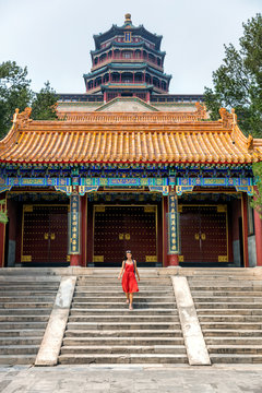 china travel lifestyle Asia summer tourism. Famous china destination. Chinese woman tourist visiting traditional religious temple in Beijing city.