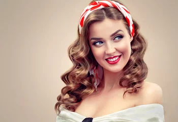 Papier Peint photo autocollant Salon de coiffure Beautiful retro vintage pin-up girl . Beautiful girl  with curly hair  pointing to the side . Presenting your product. Expressive facial expressions