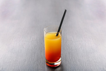Delicious tequila sunrise cocktail on table